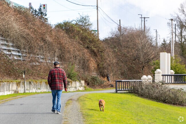 Walkers and cyclists enjoy the trails along Logboom Park near Linwood Heights.