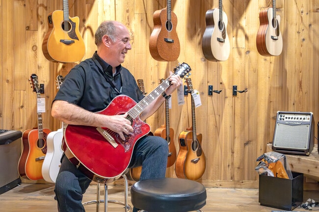 Gainesway musicians shop for acoustic guitars and other supplies at Guitar Center.