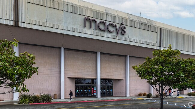 Fashion enthusiasts indulge in shopping sprees at Macy's in Glen Eden's Southland Mall.