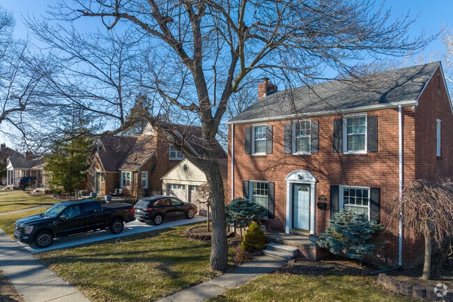 This almost symmetrical Colonial Revival in Dearborn Hills enjoys a corner lot.