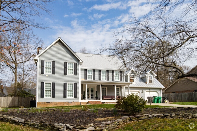 Larger two-story homes of varying styles dot the streets around Deep River.