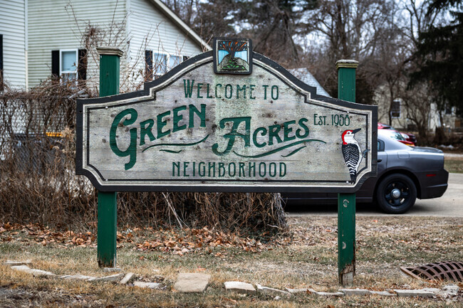 There is a welcoming sign for Green Acres near the entry of the neighborhood.