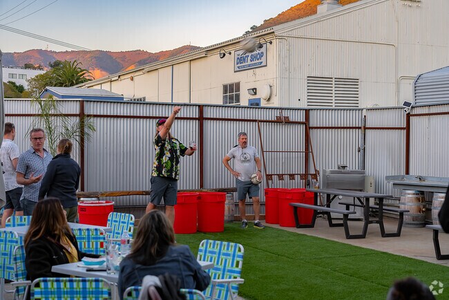 Enjoy a life-sized game of pong on the side court at Krobar Distillery.