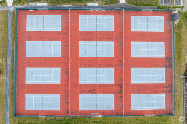 A top down view of the tennis courts at Muskego high School.