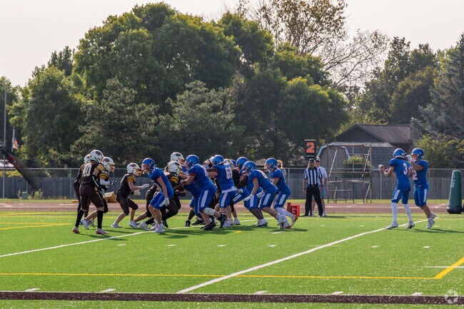A middle school football game at the local South High School Field.