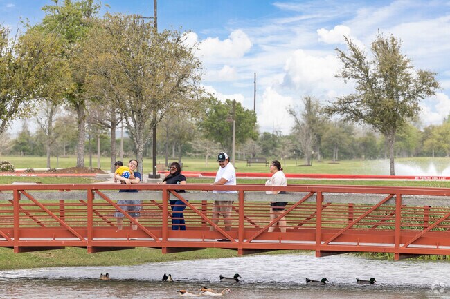 Families relish waterside views while picnicking at Mont Belvieu City Park.