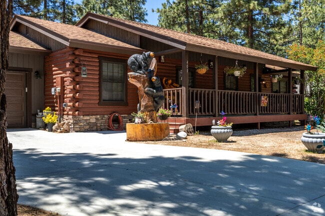A single-family home in Big Bear City featuring a front deck offers the perfect spot to relax.
