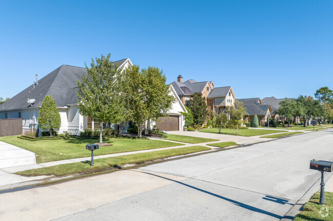 A row of homes sit along a quiet side street in the town of Friendswood, Texas.