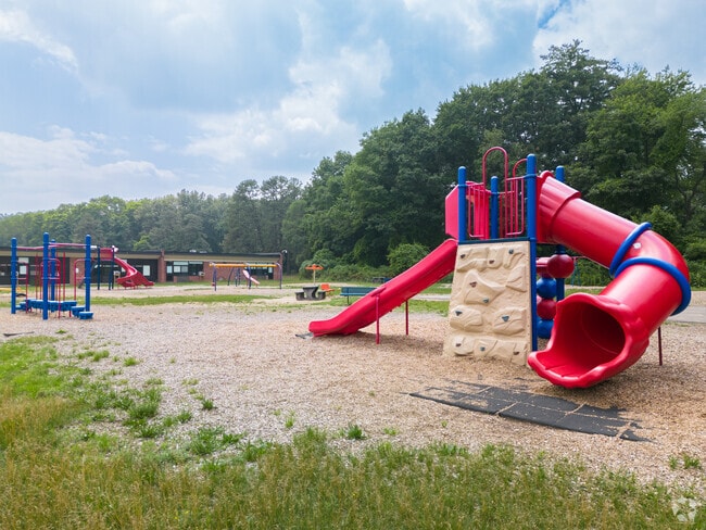 Pinewood Elementary School playground have rock climbing and slides for kids.