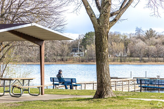 Lakeside Lions Park offers a quiet spot to take in lakeside views near Spring Lake Park.