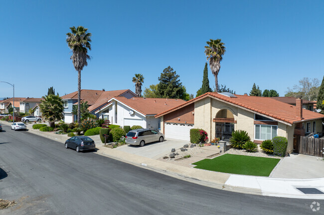 Citaldi homes blend California Ranch simplicity with Mediterranean touches like stucco walls, red tile roofs, and arched entries, creating a warm, timeless San Jose streetscape.