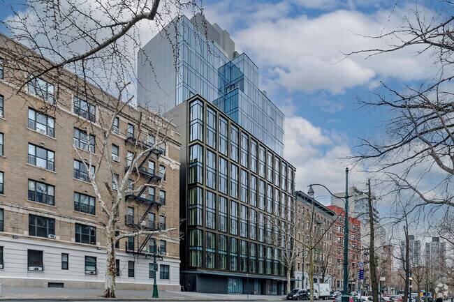 One of the new immaculate condo buildings on Central Park North in the Central Harlem community.