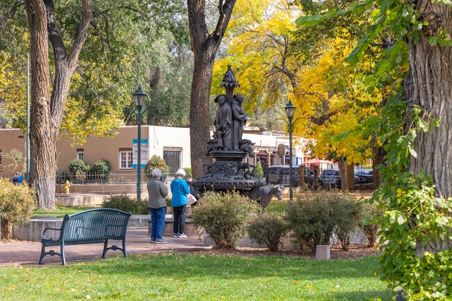 Tourists admire the statues in Santa Fe Plaza in Historic Saint Catherine's.