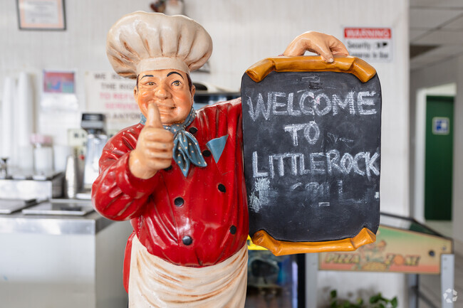 This chef greets you at Littlerock Grill in the Littlerock neighborhood.