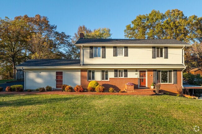 Split-level ranch homes in Fall Branch include walkways and large driveways.
