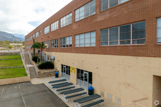 Lunch tables line the building at Immaculate Heart High School.