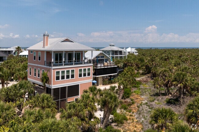 Rows of homes stand high above the trees on North Captiva Island.