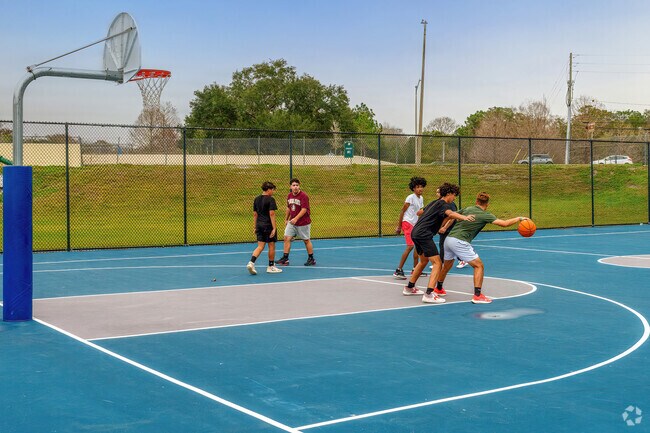 University residents enjoy pickup basketball at nearby Jay Blanchard Park.