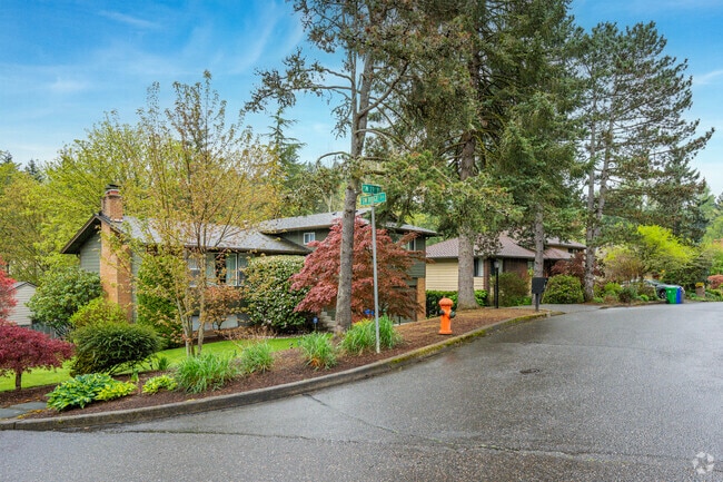 The Markham neighborhood is lined with mature trees and lush landscaping.