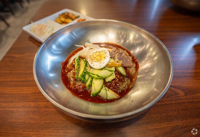 Spicy cold noodles with a hard-boiled egg are a top pick at Kimchi Il in Oakhurst.