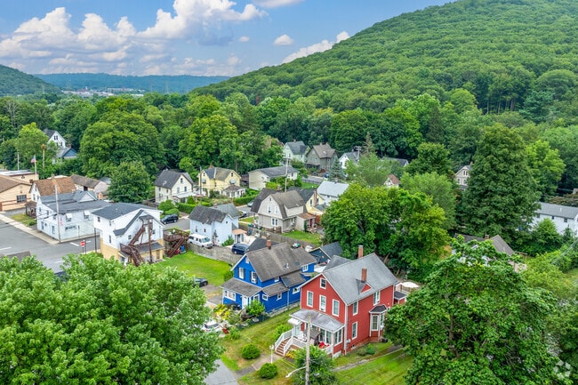 Distinctive architecture and tree-lined roads define Hillburn’s secluded residential charm.