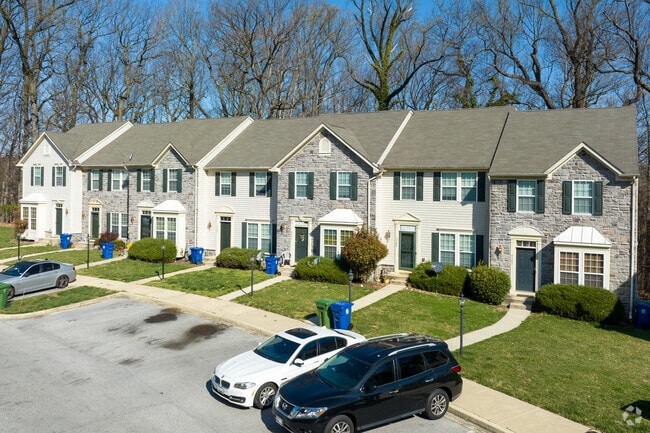 The two-story modern townhomes feature ample parking in Beechfield.