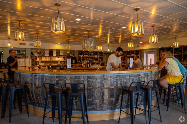 Guests sip cherry wine at Black Star Farms’ circular bar on Old Mission Peninsula.