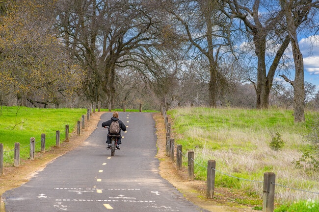 Youth takes shortcut through Pleasant Grove Creek Trails in Quail Glen.