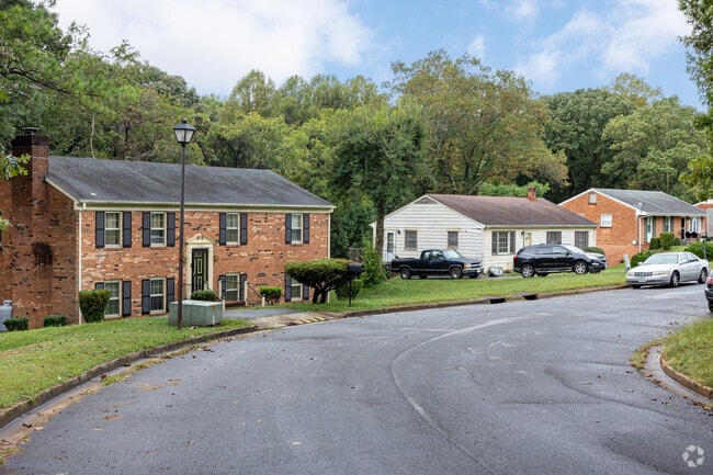 Homes in Winston Ridge display a variety of styles along lush, tree-lined streets.