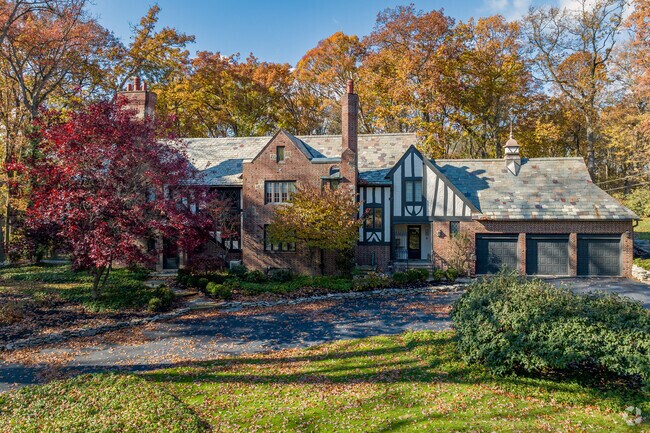 Tudor homes in Hills and Dales often sit on large wooded lots.