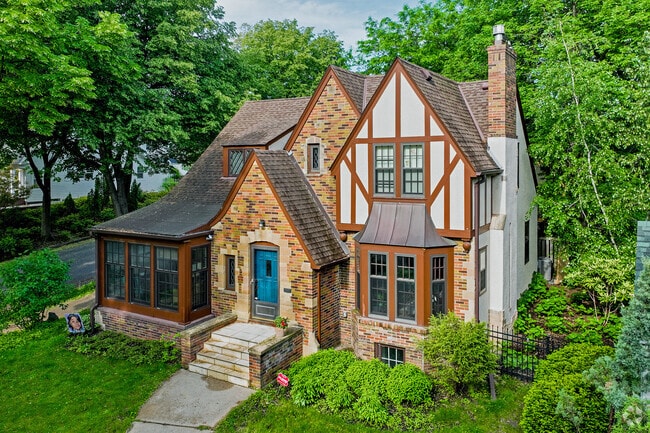 Elegant tudor-style homes grace wooded lots in East Isles.