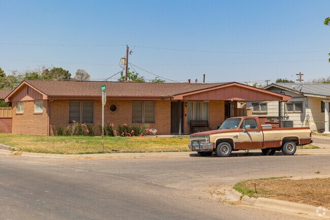 A classic pick up truck and ranch home commonly found in Pecos.