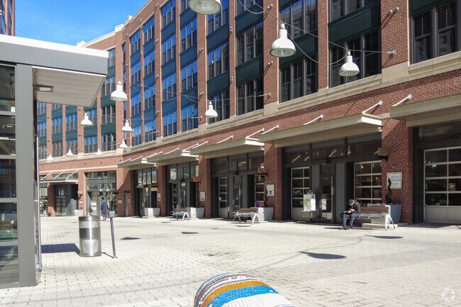 Local art lovers relax at the Brookland Arts Walk plaza in Edgewood and enjoy a sunny day.