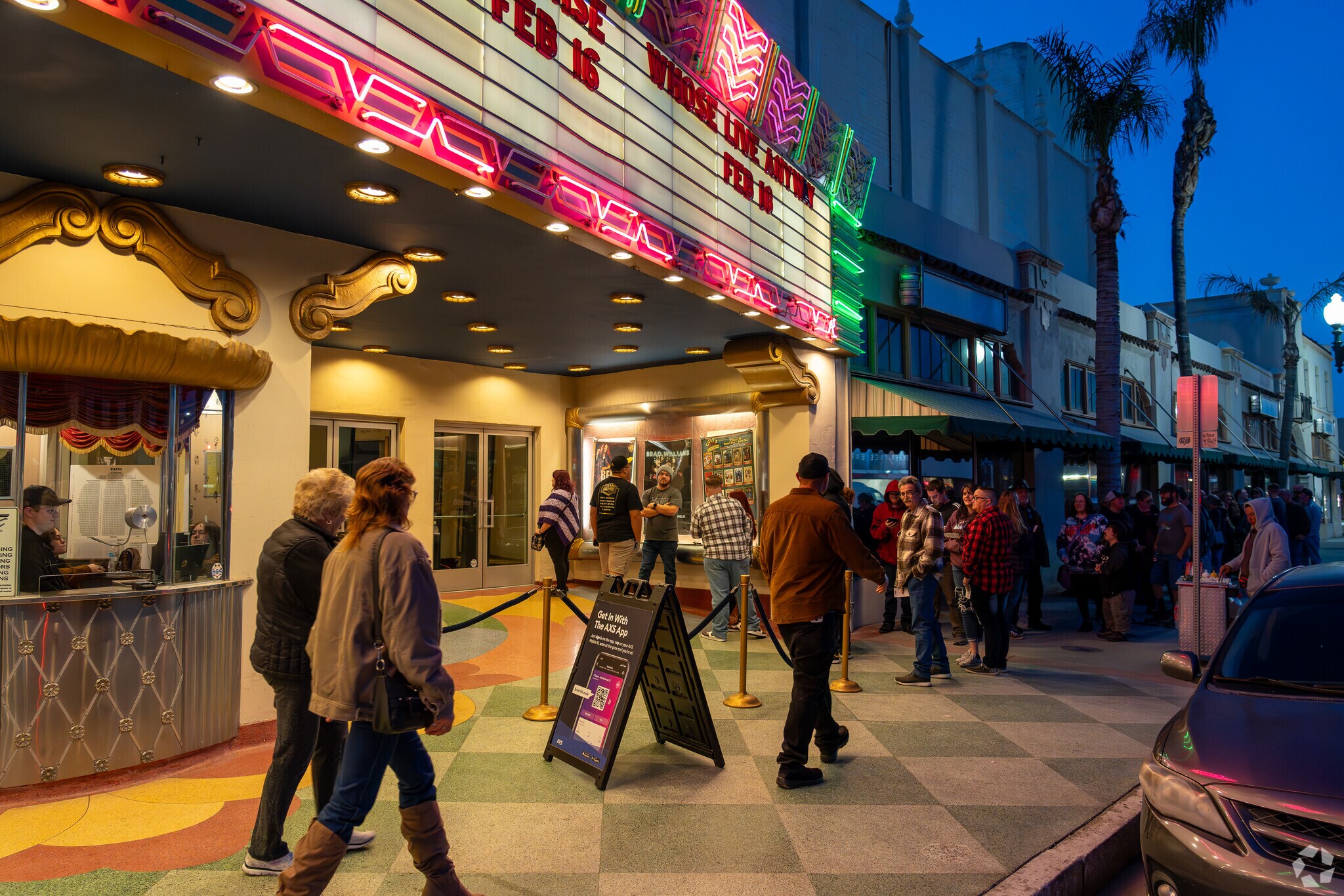 Concert goers wait in line at the Fox Theatre for the show in downtown Bakersfield.