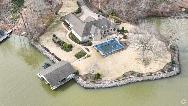 A sprawling waterfront property with a covered