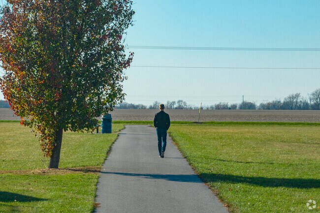 There is a paved walking path that wanders throughout Remington Community Park in Carpenter.