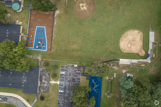 Wing Elementary School features a playground, baseball fields, and more for students in Islip.