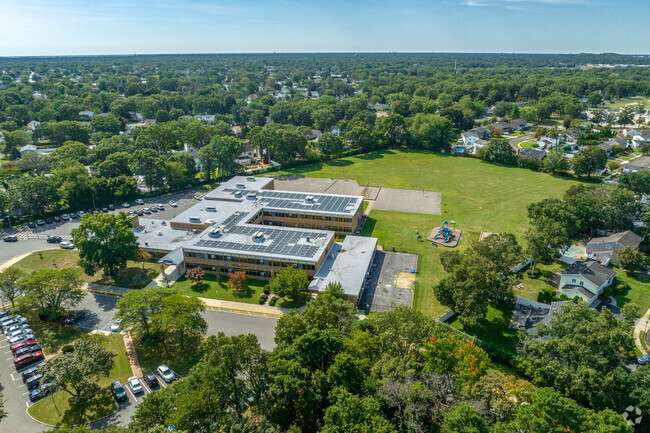 John Quincy Adams Elementary School and the lush Long Island horizon.