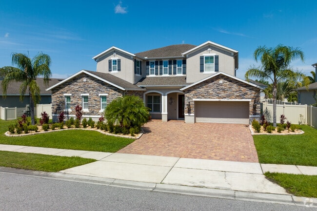 A large traditional style home in the highly sought after The Pointe at Hunters Creek community