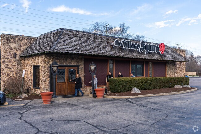 The Village Squire serves pub fare, craft beer, and cocktails in a British-style setting.