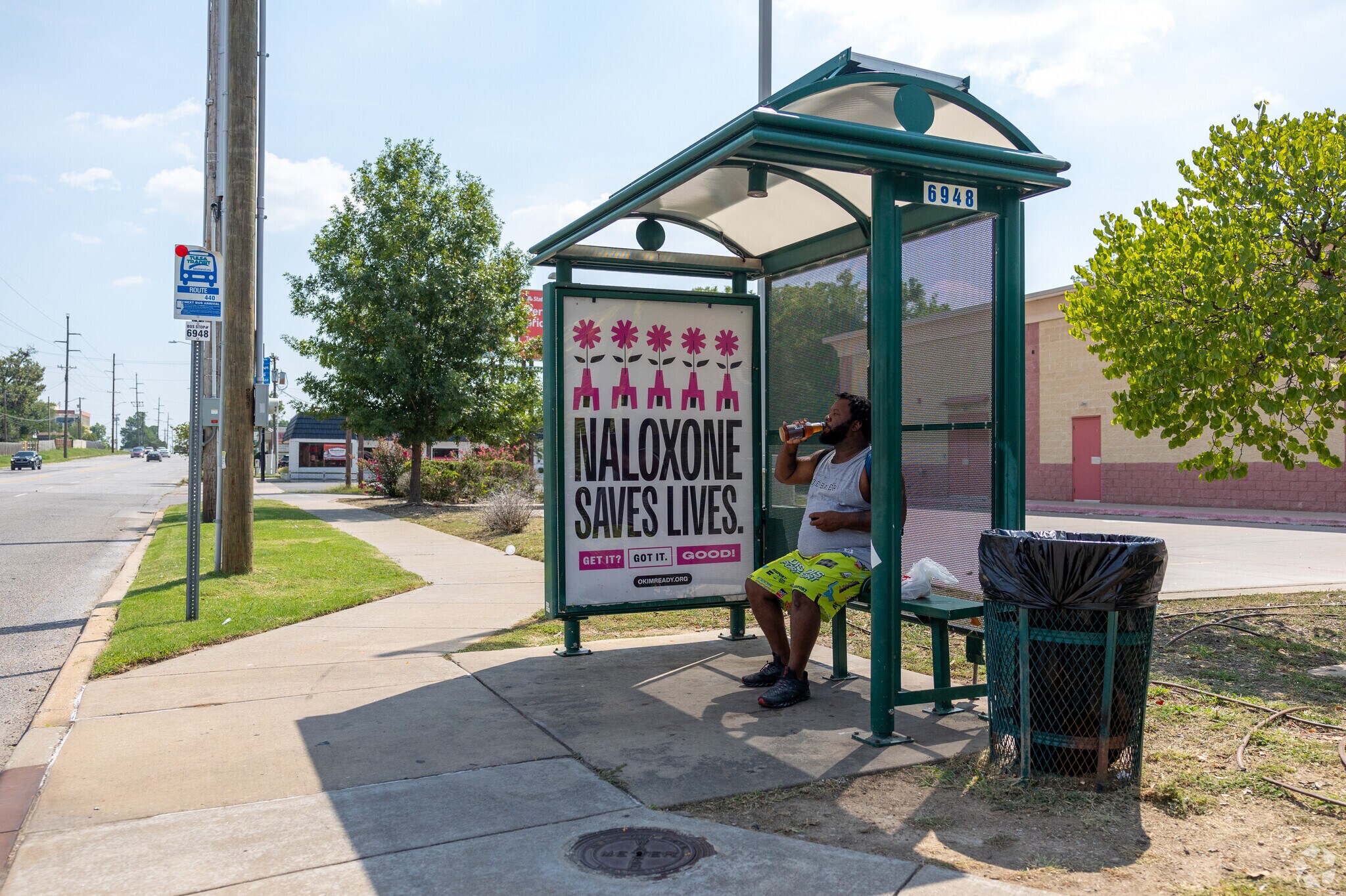 Man finds solace while awaiting the bus in Florence Park South.