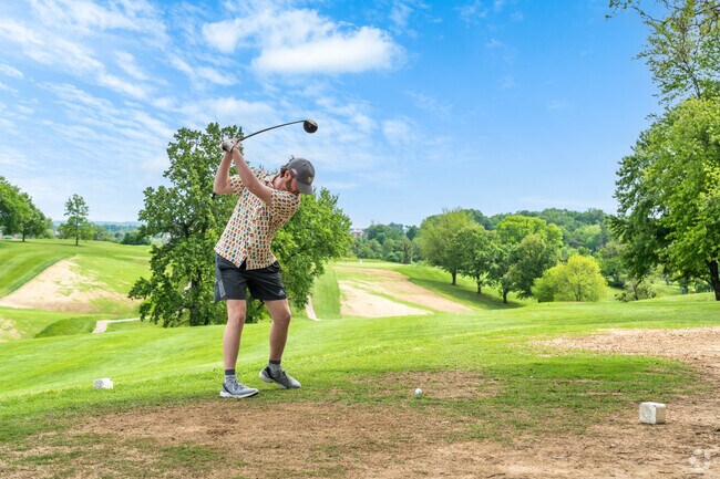 Residents of Parkers Settlement test their game on the rolling hills of Helfrich Golf Course.