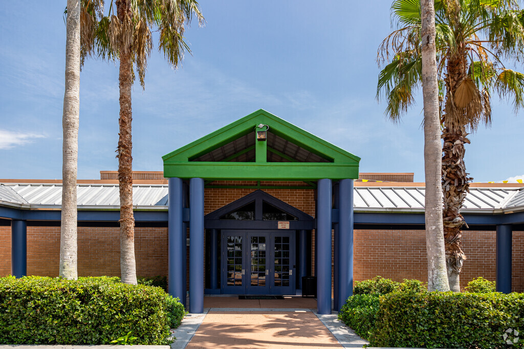 East Naples Middle School welcomes students through the main entrance.