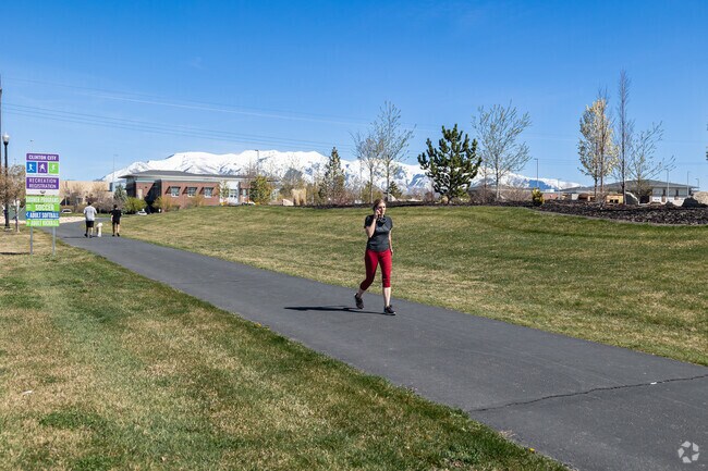 Clinton residents enjoy walking paths at Civic Center Park.