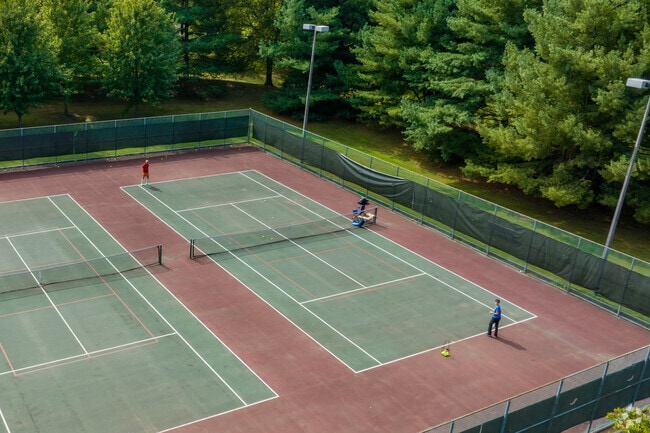 Residents of Lawrenceville enjoy friendly competition at the tennis courts of Village Park.