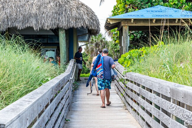 A tranquil beach provides a serene escape surrounded by natural beauty.