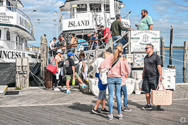 Family and friends take a day for fishing at Captree State Park.