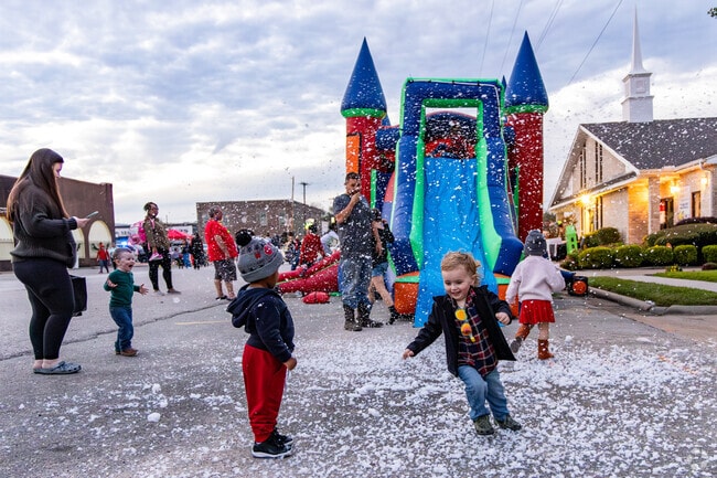 Children of Liberty County enjoy playing in the artificial snow at the Downtown Cocoa Crawl.
