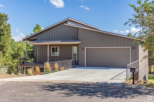 Some Elk Run homes enjoy nature from their front porches covered in shade from their roof.
