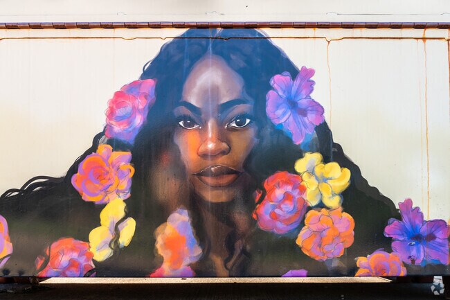 There is a beautiful art mural on the flower beds at Victory Park in Historic East Urbana.